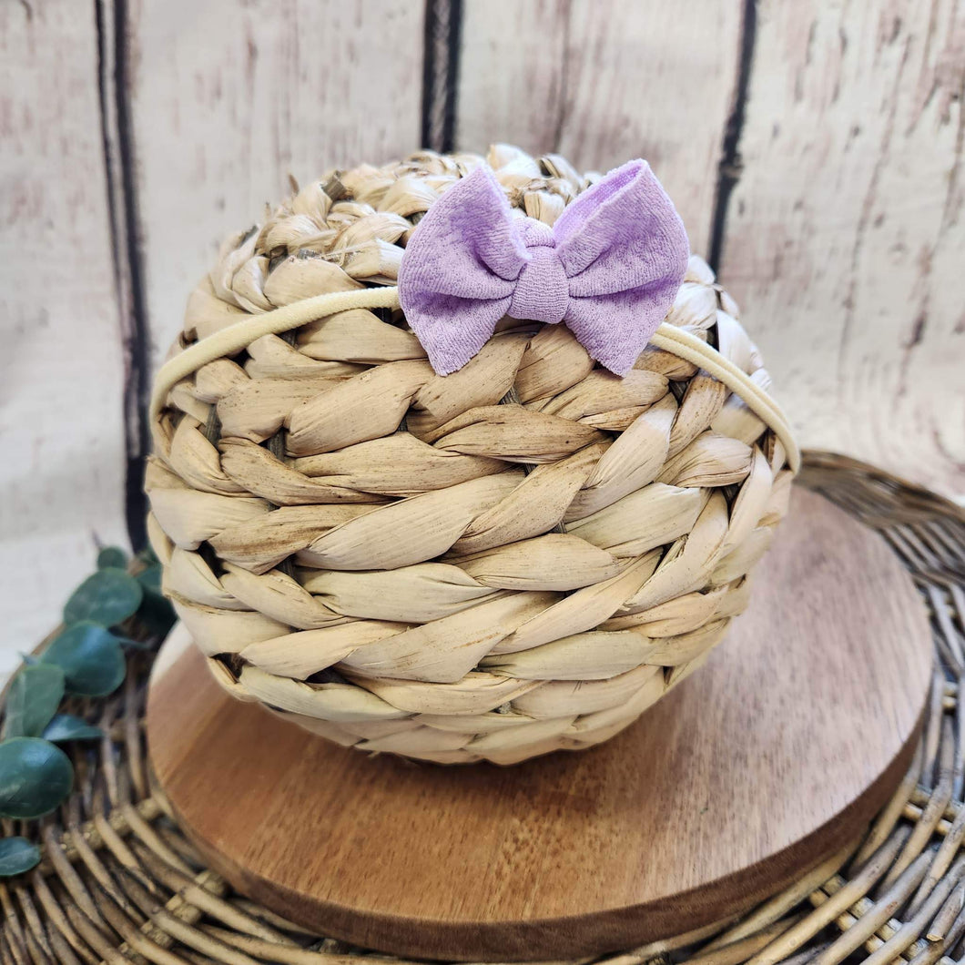 Light Lavender Itty Bitty Bow on Nude Nylon